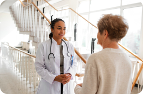 Image of a doctor talking to an employee